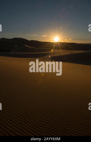 Sunset over the Hongoryn Els sand dunes in the Gobi Desert in southern Mongolia. Stock Photo