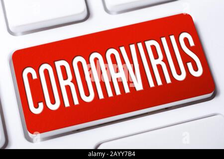 The Word Coronavirus On A Red Keyboard Button Stock Photo