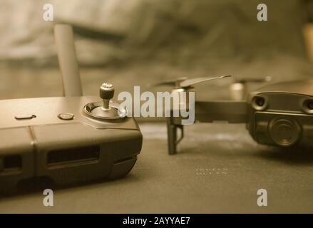 Remote controller and blurred copter in the background Stock Photo