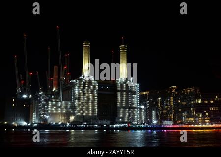 London, UK - 16 Deb 2020. Battersea Power Station construction at night over the River Thames Stock Photo