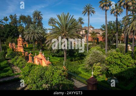 View of the gardens from the Galeria de Grutescos in the Alcazar, a royal palace, originally a Moorish fort in Seville, Andalusia, Spain. Stock Photo