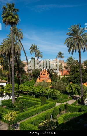 View of the gardens from the Galeria de Grutescos in the Alcazar, a royal palace, originally a Moorish fort in Seville, Andalusia, Spain. Stock Photo