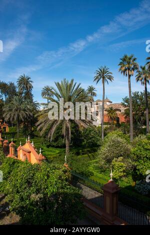 View of the gardens from the Galeria de Grutescos in the Alcazar, a royal palace, originally a Moorish fort in Seville, Andalusia, Spain. Stock Photo