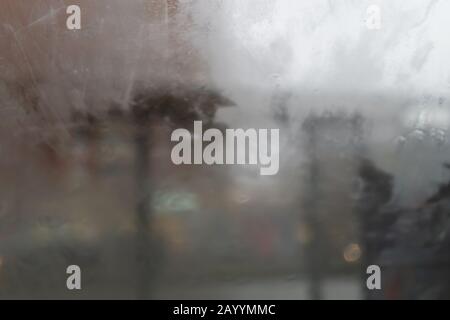 Blurred abstract background. street view through wet glass Stock Photo
