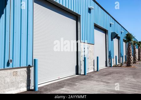 Ground level view of warehouse with roller shutter exterior doors Stock Photo