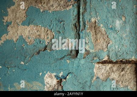 Detailed Close Up View Of Concrete Wall Surface With Rusty Armature Bars And Coarse Texture Of Peeling Paint Stock Photo