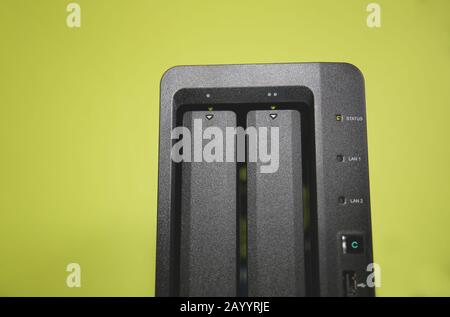 A NAS Network Attached Storage device with yellow background Stock Photo