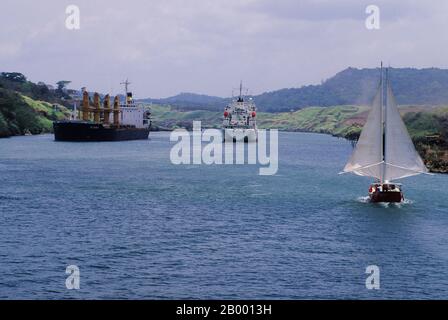 Ships passing through the Gaillard Cut of the Panama Canal in Panama. Stock Photo