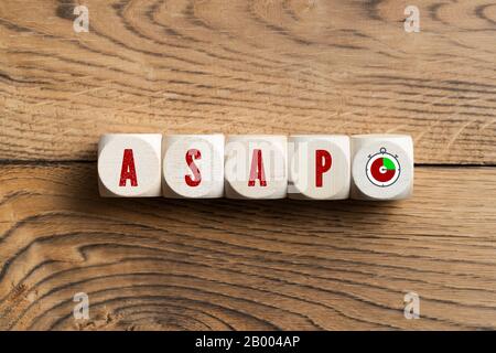 cubes with acronym ASAP on wooden background Stock Photo