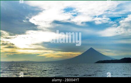 Mayon Volcano or Mt. Mayon is a sacred and active stratovolcano. Renowned  for its perfect cone, it is a popular tourist destination. Stock Photo