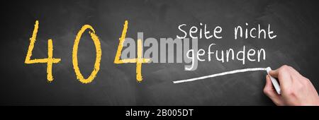 hand writing '404 - page not found' in German on a blackboard Stock Photo
