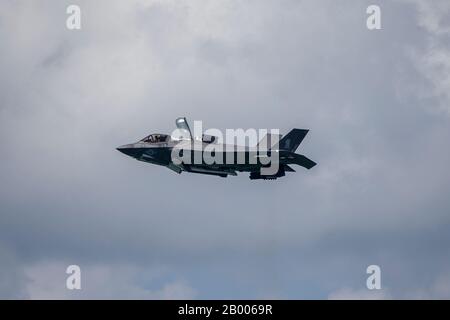 A U.S. Marine Corps F-35B Lightning II with Marine Fighter Attack Squadron (VMFA) 121 hovers in the air during an aerial demonstration at the Singapore Airshow 2020 near Changi Exhibition Center, Republic of Singapore, 2020 Feb. 15, 2020. Singapore Airshow 2020 showcased various U.S. military aircraft and featured the F-22 Raptor and the F-35B Lightning II aerial demo teams. This was the first time both stealth fighter attack jets participated in the aerial demonstration, giving spectators an unprecedented look at the advanced fifth generation fighters. (U.S. Marine Corps photo by Staff Sgt. V Stock Photo