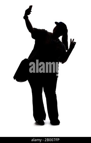 Silhouette of a curvy or plus size woman on a white background.  She is takign a selfie or streaming video online for social media as an influencer Stock Photo