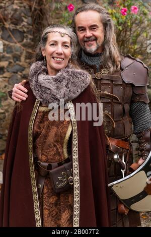 Couple posing robed in beautiful medieval clothing Stock Photo