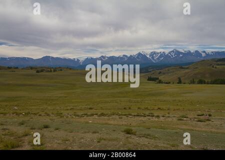 Panoramic view of a mountain valley summer. Altai mountains. Summer dark day. Stock Photo