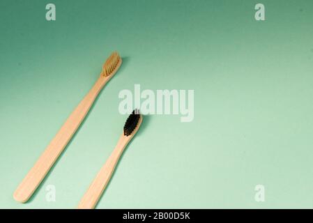 Two bamboo brushes for brushing teeth, light dark pile. Zero waste Stock Photo