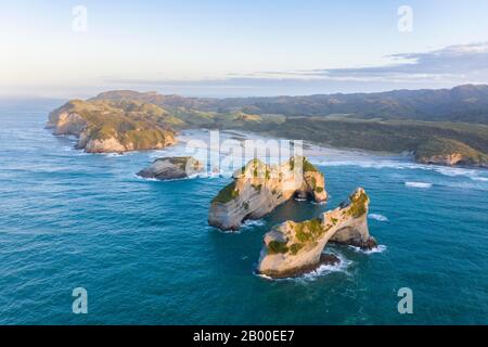 Rock island on Wharariki beach, Wharariki Beach, Golden Bay, Southland, New Zealand Stock Photo
