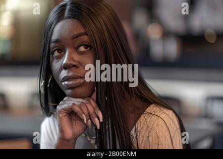 Dark skinned young woman, portrait, Duesseldorf, Germany Stock Photo