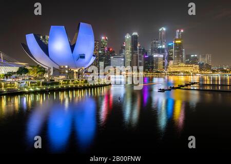 ArtScience Museum and skyline at night, Financial District, Banking District, Marina Bay, Downtown Core, Singapore Stock Photo