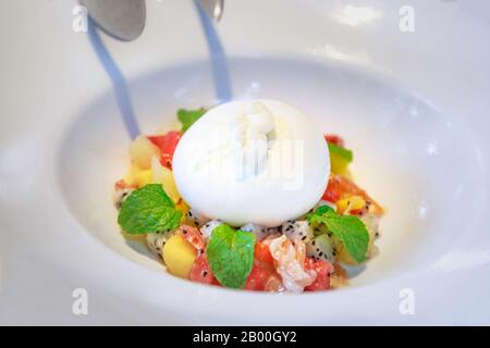 Fresh mozzarella Ball (Truffle Burrata), buttery cream and milky freshness within, accompanied by salads or bread. Made of Pasteurized Cow’s milk, Hea Stock Photo