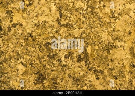 Granite texture, yellow, golden granite surface for background, material for decorative texture, interior design Stock Photo