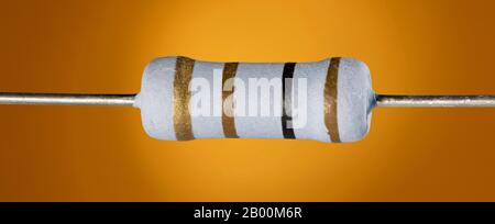 Resistor that is 100 ohms on an orange background Stock Photo