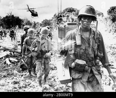 Vietnam: US soldiers on a search-and-destroy patrol in Phuoc Tuy province, South Vietnam, June 1966.  Search and Destroy, Seek and Destroy, or even simply S&D, refers to a military strategy that became a notorious component of the Vietnam War. The idea was to insert ground forces into hostile territory, search out the enemy, destroy them, and withdraw immediately afterward. The strategy was the result of a new technology, the helicopter, which resulted in a new form of warfare, the fielding of air cavalry, and was thought to be ideally suited to counter-guerrilla jungle warfare. Stock Photo