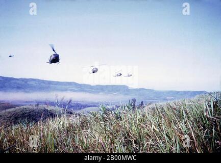 Vietnam: US Huey helicopters approaching landing zone at Dak To, November 1967.  The Battle of Đắk Tô was a series of major engagements of the Vietnam War that took place between 3 November and 22 November 1967, in Kontum Province, in the Central Highlands of the Republic of Vietnam (South Vietnam). The action at Đắk Tô was one of a series of People's Army of Vietnam (PAVN) offensive initiatives that began during the second half of the year. The battles that erupted on the hill masses south and southeast of Đắk Tô became some of the most hard-fought and bloody battles of the Vietnam War. Stock Photo