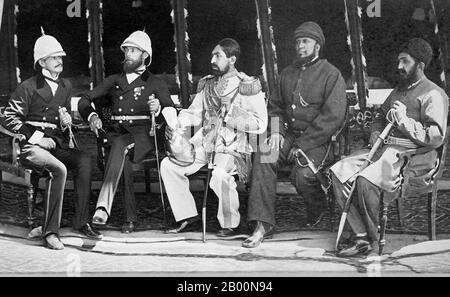 Afghanistan: Mohammad Yaqub Khan (centre) sits next to Britain's Sir Pierre Louis Napoleon Cavagnari on May 26, 1879, after the Treaty of Gandamak had been signed. Photo by John Burke (1843-1900).  The Amir Yakub Khan, General Daoud Shah, Habeebulah Moustafa, with Major Cavagnari C.S.I. and a Mr Jenkyns. The Treaty of Gandamak officially ended the first phase of the Second Anglo-Afghan War. Afghanistan ceded various frontier areas to Britain to prevent further invasion of the country. It was signed by the emir of Afghanistan, Mohammad Yaqub Khan and Sir Pierre Louis Napoleon Cavagnari. Stock Photo