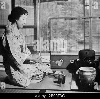 Japan: Post World War II, a kimono-clad geisha performing chanoyu (tea ceremony), 1950s.  On 6 August and 9 August, 1945, the USA dropped two atomic bombs on Hiroshima and on Nagasaki respectively. More than 200,000 people died as a direct result of these two bombings.  Japan surrendered on 15 August, 1945 and a formal Instrument of Surrender was signed on 2 September, 1945, on the battleship USS Missouri in Tokyo Bay. The surrender was accepted by Gen Douglas MacArthur as Supreme Allied Commander. After a period of US occupation (1945–1952), Japan regained its independence. Stock Photo