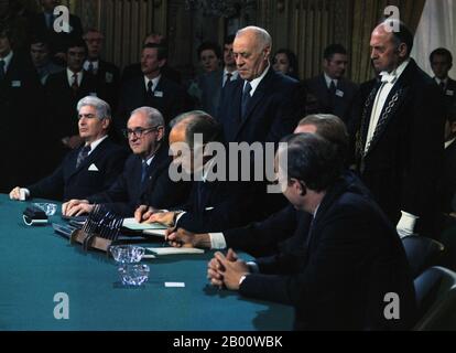 Vietnam: The US Delegation to the Paris Peace Accords signing the accord, 27 January 1973. Photo by Robert LeRoy (1929-1989), public domain.  The Paris Peace Accords of 1973, intended to establish peace in Vietnam and an end to the Vietnam Conflict, ended direct U.S. military involvement and temporarily stopped the fighting between north and south. The governments of the Democratic Republic of Vietnam (North Vietnam), the Republic of Vietnam (South Vietnam), and the United States, as well as the Provisional Revolutionary Government (PRG) that represented indigenous South Vietnamese. Stock Photo