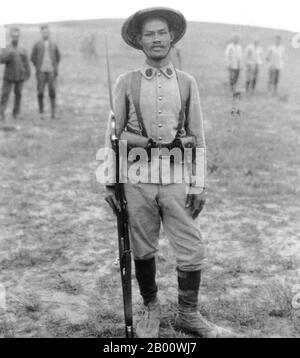 Vietnam: An Annamese 'tirailleur' or Vietnamese colonial soldier waiting to go into battle at Ypres, Belgium, in 1916.  Ypres occupied a strategic position during World War I because it stood in the path of Germany's planned sweep across the rest of Belgium and into France. In the Second Battle of Ypres (22 April to 25 May 1915), the Germans used poison gas for the first time on the Western Front (they had used it earlier at the Battle of Bolimov on 3 January 1915) and captured high ground east of the town. The first gas attack occurred against Canadian, British, and French soldiers. Stock Photo