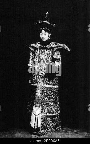 China: Empress Xiao Ke Min, also known as Empress Wan Rong (Wan-Jung) (13 November 1906 – 20 June 1946).  Gobulo Wan Rong ('Beautiful Countenance') was the daughter of Rong Yuan, the Minister of Domestic Affairs of the Qing Government and head of one of Manchuria's most prominent, richest families. At the age of 17, Wan Rong was selected from a series of photographs presented to the Xuan Tong Emperor (Puyi). The wedding took place when Puyi reached the age of 16. Wan Rong was the last Empress Consort of the Qing Dynasty in China, and later Empress of Manchukuo (Manchurian Empire). Stock Photo