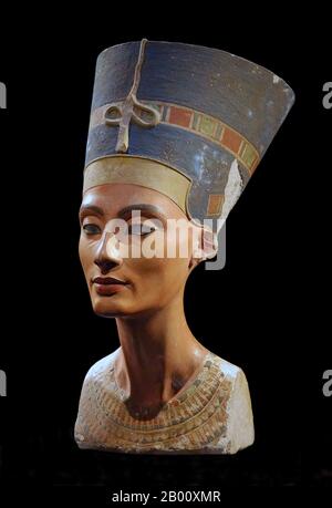 Egypt: Nefertiti (1370 BCE – c. 1330 BCE), Great Queen of Pharaoh Akhenaten of the 18th Dynasty (r.c. 1351-34 BCE).  Nefertiti  (c. 1370 BCE – c. 1330 BCE) was the Great Royal Wife of the Egyptian Pharaoh Akhenaten . Nefertiti and Akhenaten were known for a religious revolution, in which they started to worship one god only. This was the Sun God Aten. She is also famous for her bust, now in Berlin's Neues Museum. Some scholars believe that Nefertiti ruled briefly after her husband's death and before the accession of Tutankhamun as Neferneferuaten, although this is a matter of ongoing debate. Stock Photo