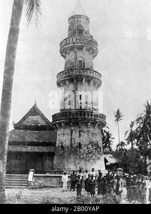 Cambodia: A 1918 photograph of the minaret and mosque in Svay Kleang in Kompong Cham Province.  Built in 1834, the majestic Muslim tower, or 'suen', is located on the banks of the Mekong River in the village of Svay Kleang, which has been the heart of Cambodia’s minority Muslim community for centuries and played a key part in the Cham Rebellion against the Khmer Rouge in 1975. The Cham are an Austronesian people who probably migrated from Borneo. The Champa Kingdom peaked in the 9th century when it controlled the lands between Hue in central Annam to the Mekong Delta in Cochinchina. Stock Photo