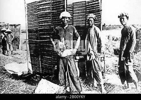 Vietnam: Farmers pose for the camera near Saigon (early 20th century).  Vietnam's independence was gradually eroded by France in a series of military conquests from 1859 until 1885 when the entire country became part of French Indochina. Significant political and cultural changes were placed on the Vietnamese people, including the propagation of Roman Catholicism. When Emperor Thanh Thai, who was opposed to French colonial rule, was exiled in 1907, the French decided to pass the throne to his son who was only seven years old, because they thought someone so young would be easily controlled. Stock Photo