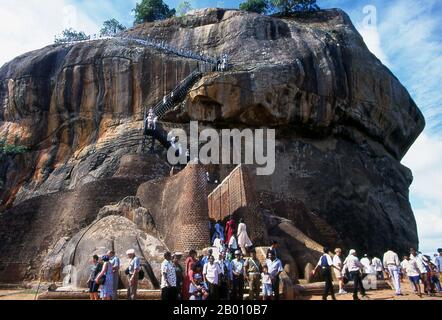 Sri Lanka: Visitors climbing Sigiriya (Lion's Rock).  Sigiriya (Lion's Rock) was built during the reign of King Kasyapa I (CE 477 – 495), and is a World Heritage Site. Stock Photo