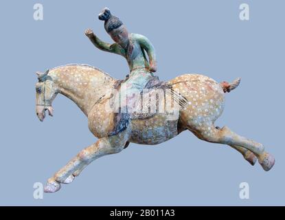 China: Tang dynasty ceramic horse with polo player, early 8th century.  The Tang Dynasty (Chinese: 唐朝; pinyin: Táng Cháo; June 18, 618 – June 1, 907) was an imperial dynasty of China preceded by the Sui Dynasty and followed by the Five Dynasties and Ten Kingdoms Period. It was founded by the Li (李) family, who seized power during the decline and collapse of the Sui Empire. The dynasty was interrupted briefly by the Second Zhou Dynasty (October 8, 690 – March 3, 705) when Empress Wu Zetian seized the throne, becoming the first and only Chinese empress regnant, ruling in her own right. Stock Photo