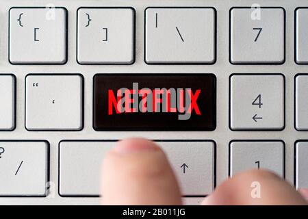 Dedicated Netflix key on computer keyboard, concept picture of global communications and modern TV streaming. February 9, 2020, Barnaul, Russia Stock Photo