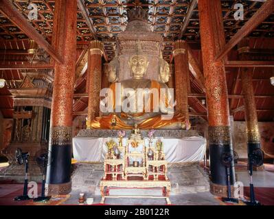 Thailand: Four identical Sukhothai-style Buddha images at the centre of Wat Phumin, Nan, North Thailand.  Wat Phumin was constructed in 1596 and is famous for its cruciform ubosoth and well preserved Tai Lue murals depicting everyday life in the 19th century.  Nan dates from the mid-14th century and for much of its history was an isolated kingdom. The present day city spreads out along the Nan River's right bank. Stock Photo