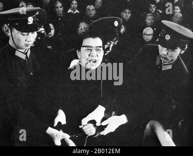 China: Jiang Qing (1914-1991), also known as Madame Mao, after her fall from power and arrest as a counter-revolutionary. She was handcuffed and defiant in court, c. 1980.  Jiang Qing (Chiang Ch'ing, March 1914  – May 14, 1991) was the pseudonym that was used by Chinese leader Mao Zedong's last wife and major Communist Party of China power figure.  She went by the stage name Lan Ping during her acting career, and was known by various other names during her life. She married Mao in Yan'an in November 1938, and is sometimes referred to as Madame Mao in Western literature, serving as first lady. Stock Photo