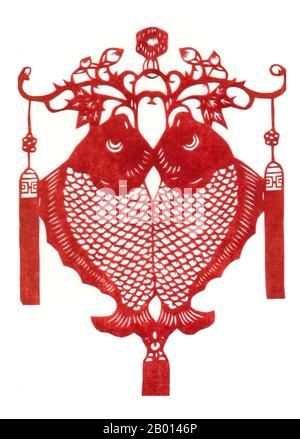 China: A paper cutting of auspicious twin fish.  In China, the fish is symbolic of unity and fidelity as it is noted that fish often swim together in pairs. With this in mind, fish are often given as wedding gifts in the form of charms or figurines to present the newly-wed couple with an auspicious sign of fidelity and perfect union. They also represent fertility and abundance due to their ability to reproduce in speed and volume. Stock Photo