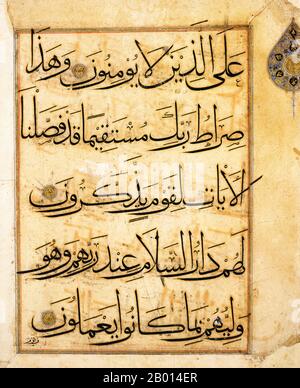 Iraq: Leaf from a Qur'an in Kufic script dated between 1350 and 1400.  This leaf is written in an elegant Muhaqqaq script, the black letters  contoured in gold. The calligraphy resembles that of magnificent Il-Khanid Qur'ans, but the verse markers indicate a slightly later dating, under the Jalayirids. Stock Photo