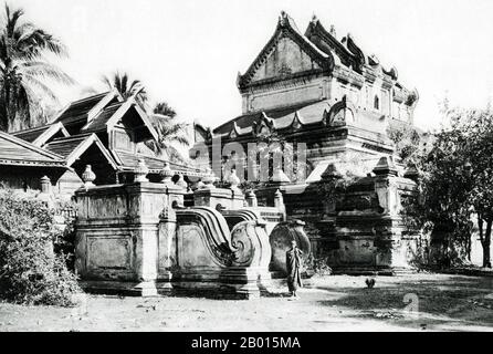 Burma/Myanmar: A Buddhist monastery in Monywa, Upper Burma, c. 1920s.  The Burmese city of Monywa is in Sagaing Division, located 136 km northwest of Mandalay on the eastern bank of the River Chindwin.  Legend attributes the first Buddhist doctrine in Burma to 228 BC when Sohn Uttar Sthavira, one of the royal monks to Emperor Ashoka the Great of India, came to the country with other monks and sacred texts. However, the era of Buddhism truly began in the 11th century after King Anawrahta of Pagan (Bagan) was converted to Theravada Buddhism. Today, 89% of the population of Burma is Buddhist. Stock Photo