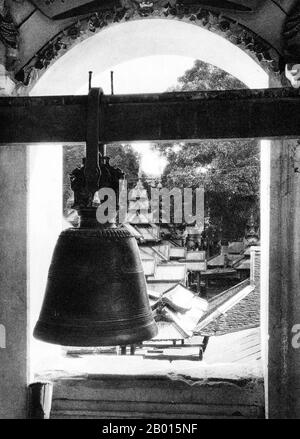 Burma/Myanmar: A pagoda bell in a Buddhist monastery in Monywa, Upper Burma, c. 1920s.  The Burmese city of Monywa is in Sagaing Division, located 136 km northwest of Mandalay on the eastern bank of the River Chindwin.  Legend attributes the first Buddhist doctrine in Burma to 228 BCE when Sohn Uttar Sthavira, one of the royal monks to Emperor Ashoka the Great of India, came to the country with other monks and sacred texts. However, the era of Buddhism truly began in the 11th century after King Anawrahta of Pagan (Bagan) was converted to Theravada Buddhism. Stock Photo