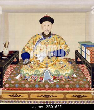 China: The Qianlong Emperor (25 September 1711 - 7 February 1799), at his writing table. Hanging scroll painting by Giuseppe Castiglione (1688-1766), c. 1750.  The Qianlong Emperor, born Hongli and temple name Gaozong, was the fifth emperor of the Qing Dynasty. The fourth son of the Yongzheng Emperor, he reigned officially from 1735 to 1796, before abdicating in favor of his son, the Jiaqing Emperor - a filial act to not rule longer than his grandfather, the Kangxi Emperor. Despite his retirement, he retained ultimate power until his death. Stock Photo