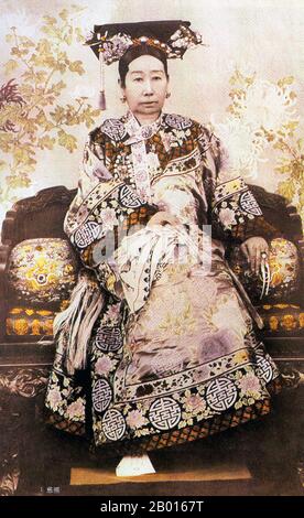 China: Empress Dowager Cixi (29 November 1835 - 15 November 1908) photographed c. 1890.  Empress Dowager Cixi, personal name Xingzhen, was the concubine of the Xianfeng Emperor. Of the Manchu Yehe Nara Clan, she was a powerful and charismatic figure who became the de facto ruler of the Qing Dynasty for 47 years, from 1861 to 1908. Her son became the Tongzhi Emperor, and she ruled as regent in his stead, alongside Empress Dowager Ci'an. She consolidated her control by installing her nephew as the Guangxu Emperor after her son's death. Her legacy is heavily debated. Stock Photo