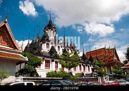 Thailand: Loha Prasad (Brazen Palace or Iron Monastery), Wat Ratchanatda, Bangkok.  Wat Ratchanaddaram was built on the orders of King Nangklao (Rama III) for Mom Chao Ying Sommanus Wattanavadi in 1846. The temple is best known for the Loha Prasada (Loha Prasat), a multi-tiered structure 36 m high and having 37 metal spires. It is only the third Loha Prasada (Brazen Palace or Iron Monastery) to be built and is modelled after the earlier ones in India and Anuradhapura, Sri Lanka. Stock Photo