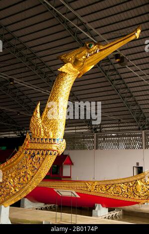 Thailand: Suphannahongse (Golden Swan), the King's barge, Royal Barges Museum, Bangkok.  Suphannahongse (Suphannahong), the King's personal barge, was carved out of one teak tree and completed in 1911.  Thailand's royal barges have been used in ceremonies on Bangkok's Chao Phraya River since the 18th century, but were also used prior to this period in the Ayutthayan era. The exquisitely crafted Royal Barges are a blend of craftsmanship and traditional Thai art. The Royal Barge Procession takes place rarely, typically coinciding with only the most significant cultural and religious events. Stock Photo