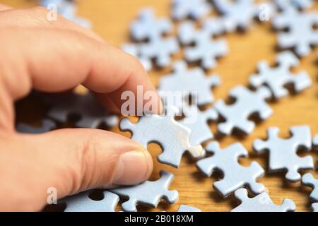 Choose a piece of a jigshaw puzzle Stock Photo